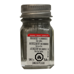 Studio shot of the classic Testors Steel Flat Enamel Paint glass jar showing the warning label and a metallic screw cap