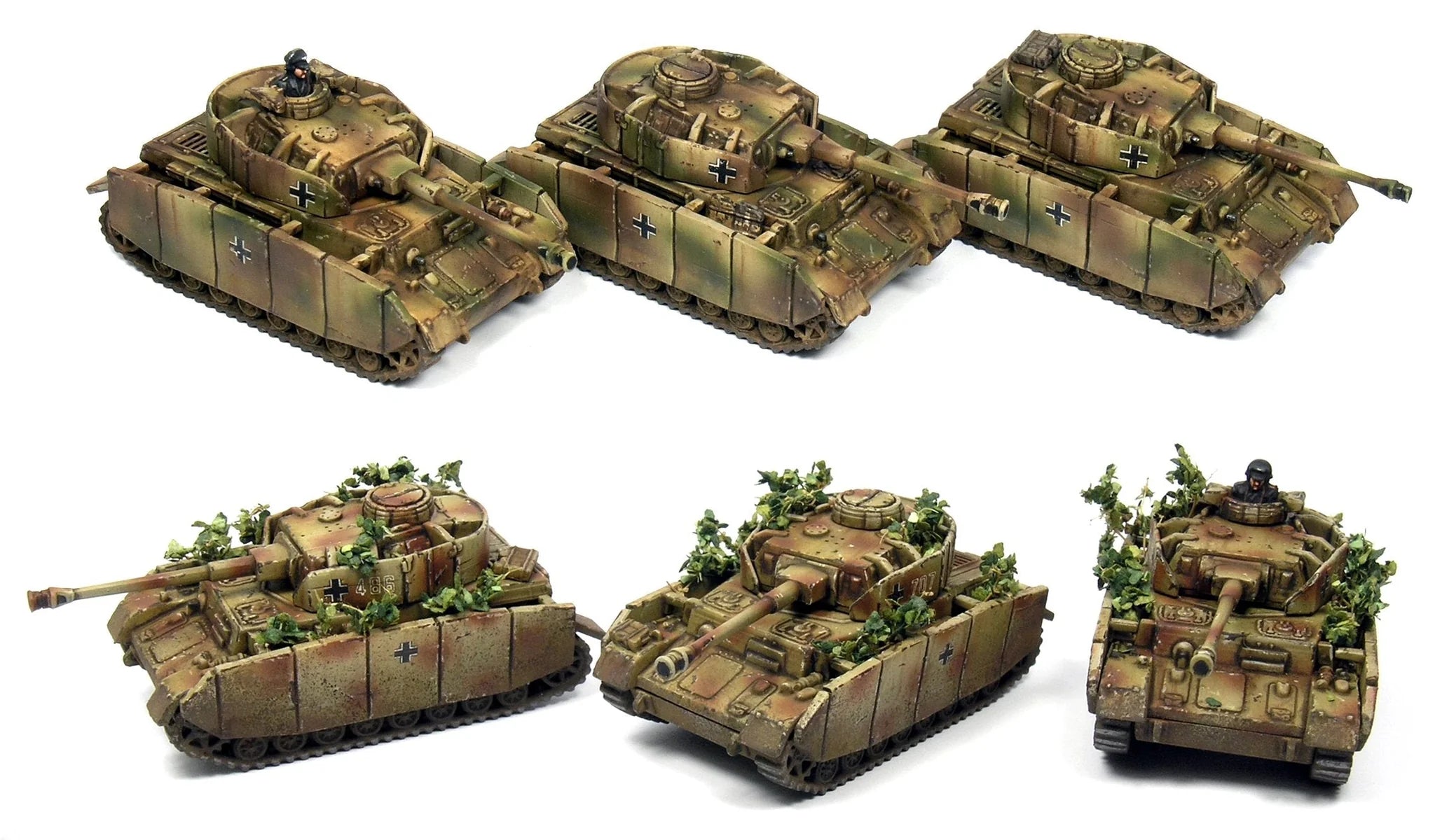 Six painted Victrix 12mm Panzer IV Ausf H models showing clean and foliage-camouflaged variants