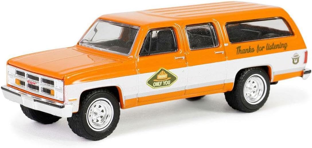 Side profile of 1983 GMC Suburban with Smokey Bear graphics