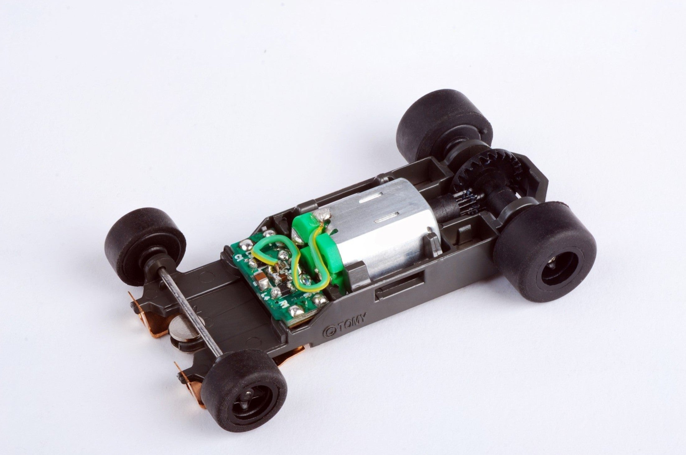 Top view of AFX Mega G+ long wheelbase rolling chassis for HO slot cars