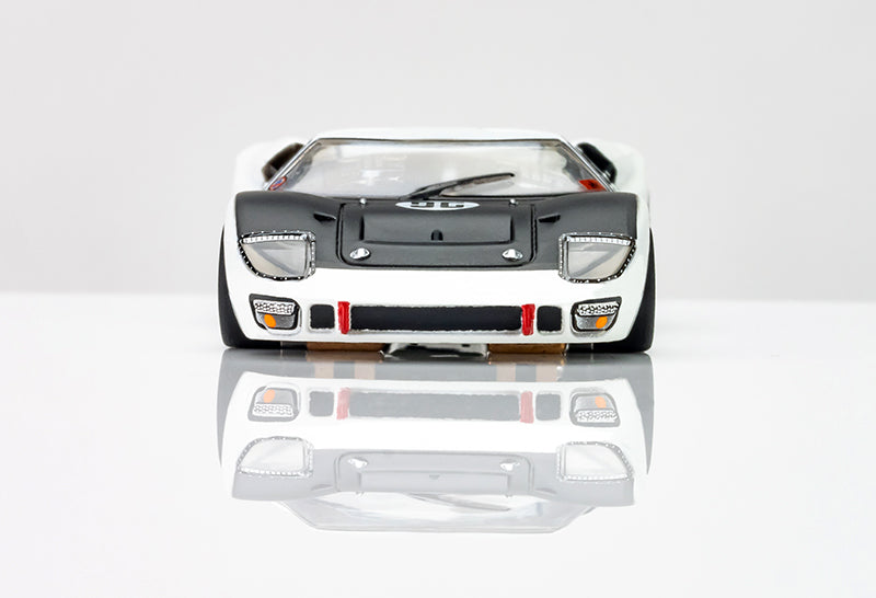 Direct front view of 1/64 scale AFX Ford GT40 MKII slot car displaying aerodynamic front air dam and clear headlights.