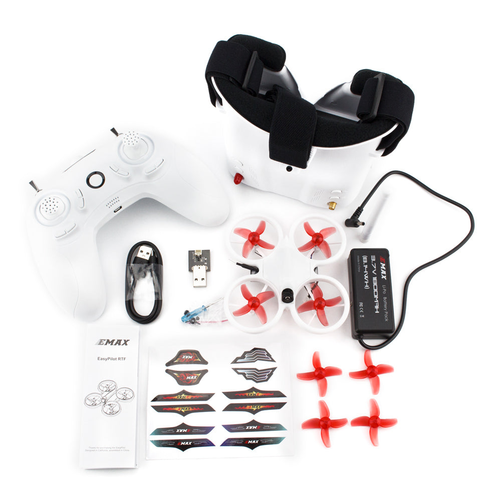 All included components of the EZ Pilot kit are laid out, including battery packs, chargers, and spare props.