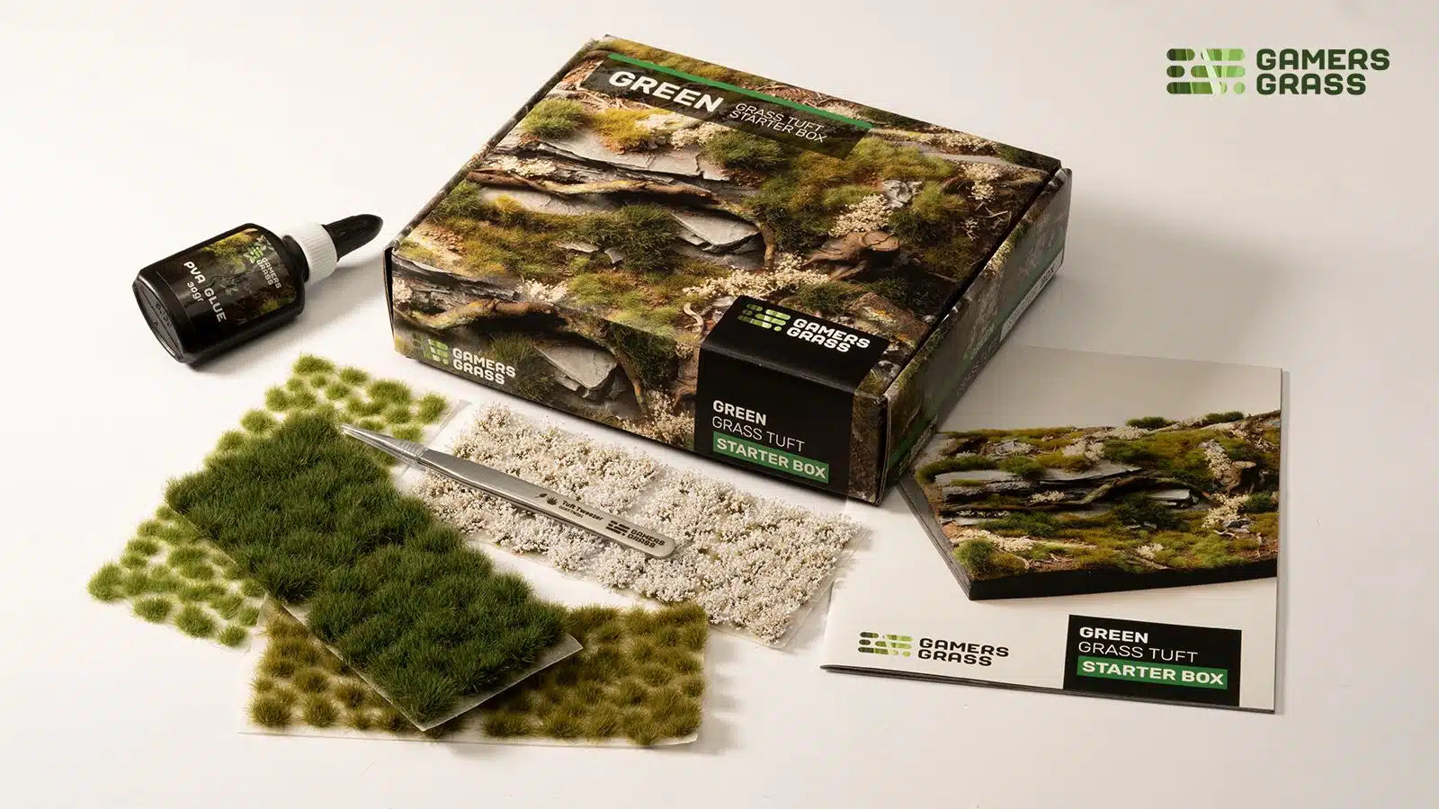 Gamers Grass Green Grass Tuft Starter Box including tweezers, PVA glue, and basing guide for professional miniature modeling.