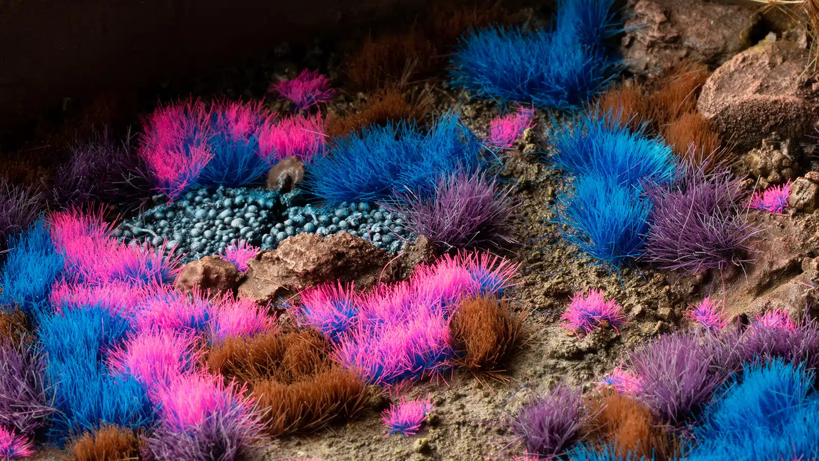 A professional diorama shot featuring the vibrant Alien Neon, Blue, and Purple tufts from the GamersGrass Mystic Nebulae Set.