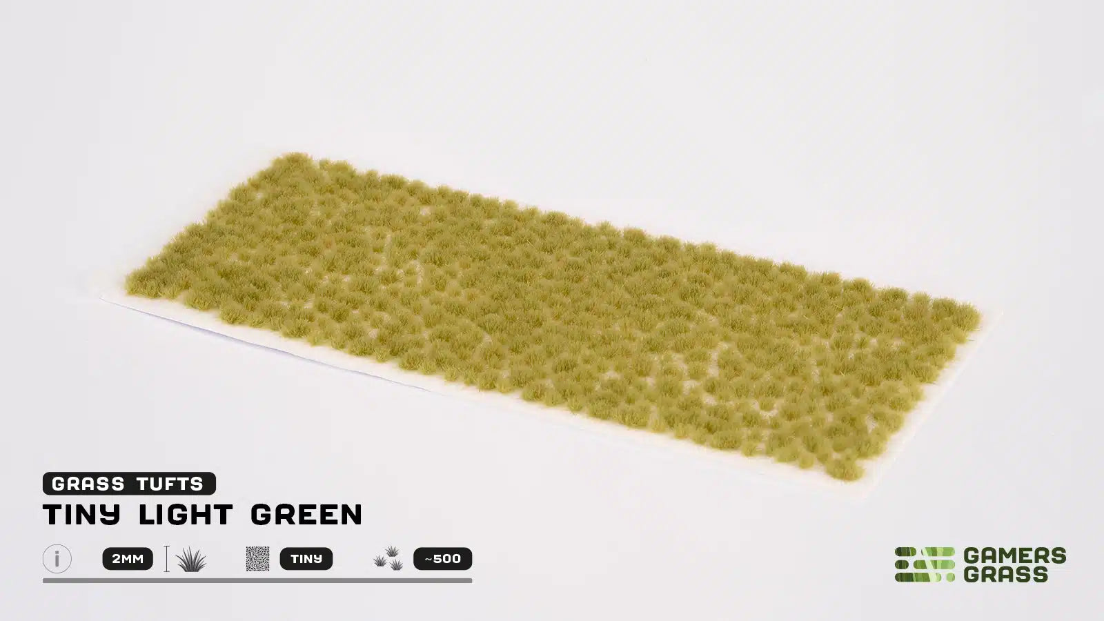 Full sheet view of approximately 500 GamersGrass Tiny Light Green self-adhesive tufts for miniature basing.