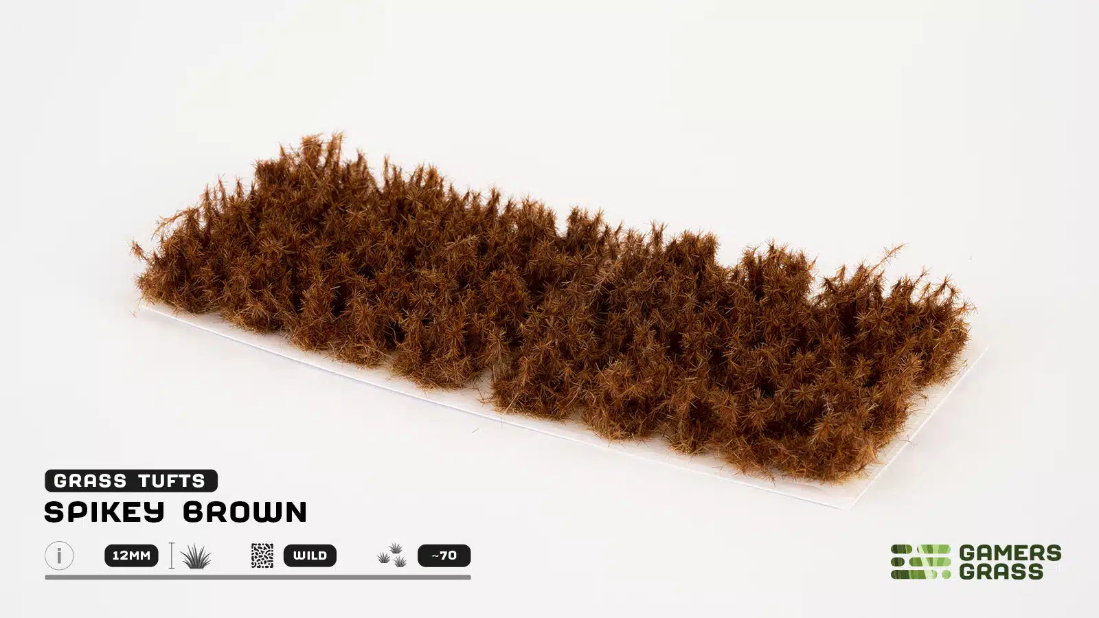 A full sheet of approximately 70 GamersGrass Spikey Brown 12mm self-adhesive tufts.
