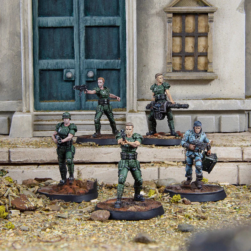 Painted Reilly’s Rangers miniatures deployed in a ruined urban tabletop battle scene