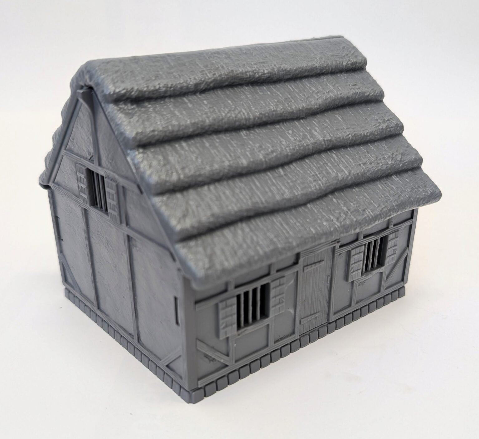 Fully assembled unpainted gray plastic Tabletop Workshop Cottage
