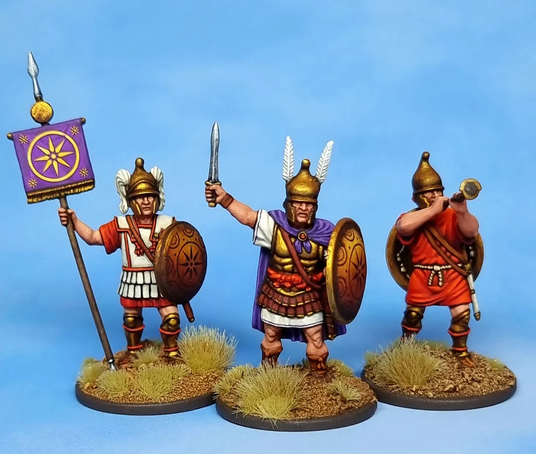 Three painted Victrix 28mm Macedonian command figures including standard bearer commander and trumpeter