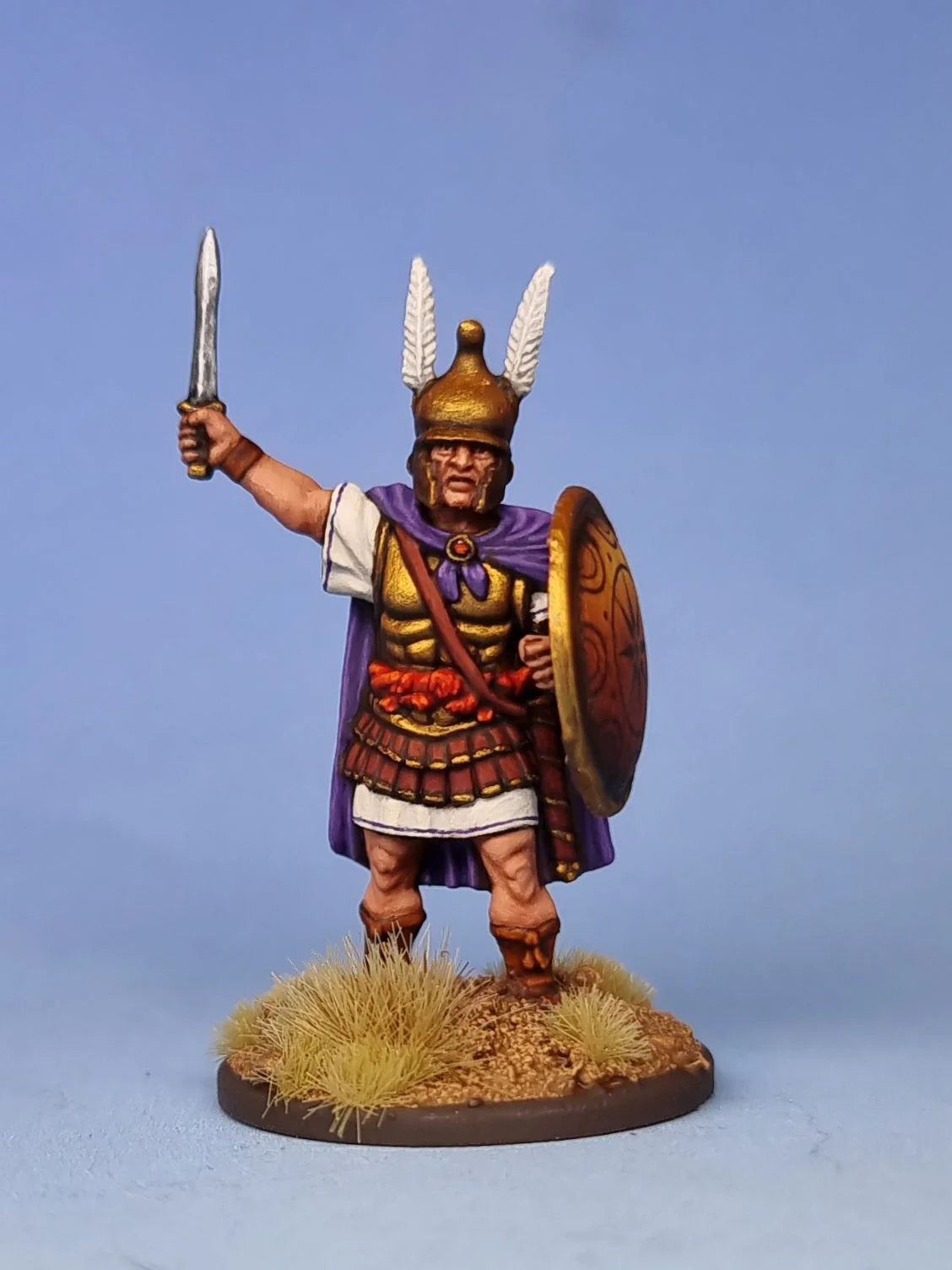 Close-up view of a custom painted Victrix 28mm Macedonian officer figure holding a raised sword