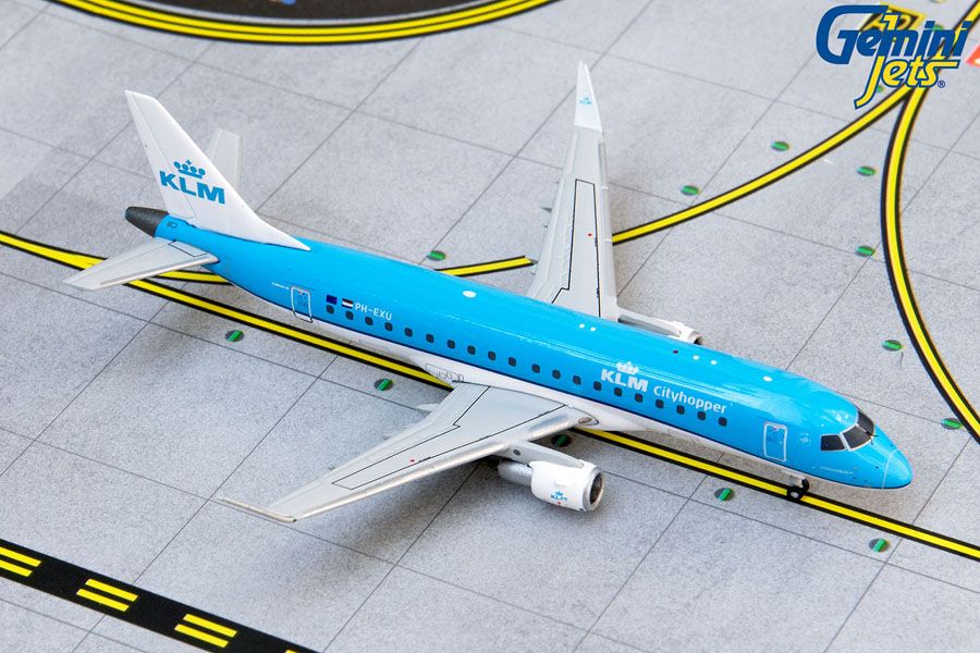 Top down angle of GeminiJets 1 by 400 scale KLM Royal Dutch Airlines Embraer ERJ 175 diecast model PH EXU parked on an airport diorama mat