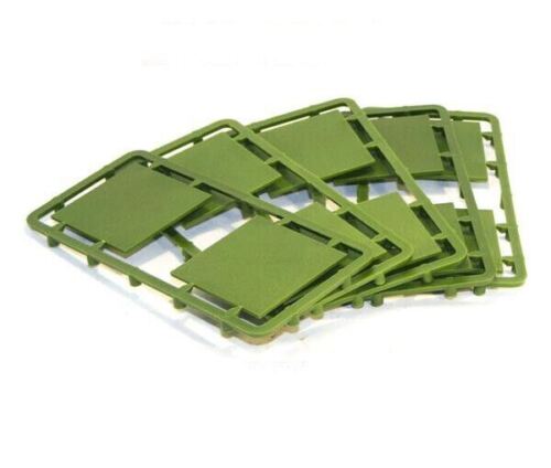 Five unpainted green hard plastic sprue frames from the Renedra 40mm Square plastic bases kit displaying ten 40x40mm wargaming bases.