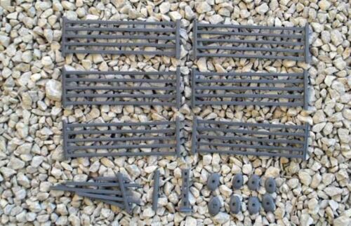 Unassembled gray hard plastic sprue frame of the Renedra 5 Bar Fencing kit showing multiple fence segments, loose posts, and mounting bases