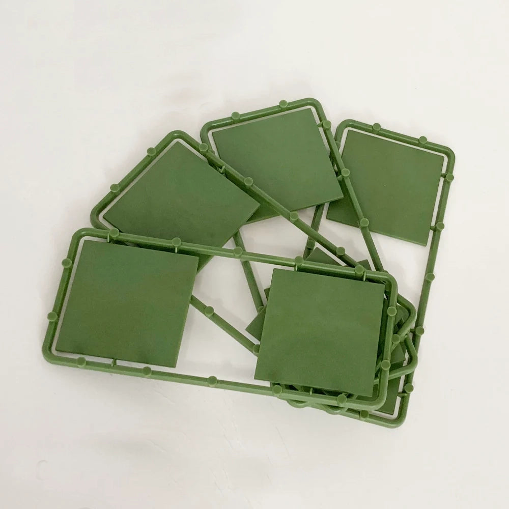 Sprue view of Renedra 50 mm square bases molded in green hard plastic