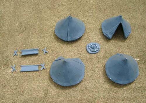 Gray hard plastic components from the Renedra Bell Tents kit including four conical tents, two folding cots, and a rock campfire