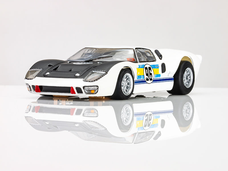 Front three-quarter angle of white AFX Ford GT40 MKII Daytona endurance slot car on white background. 
