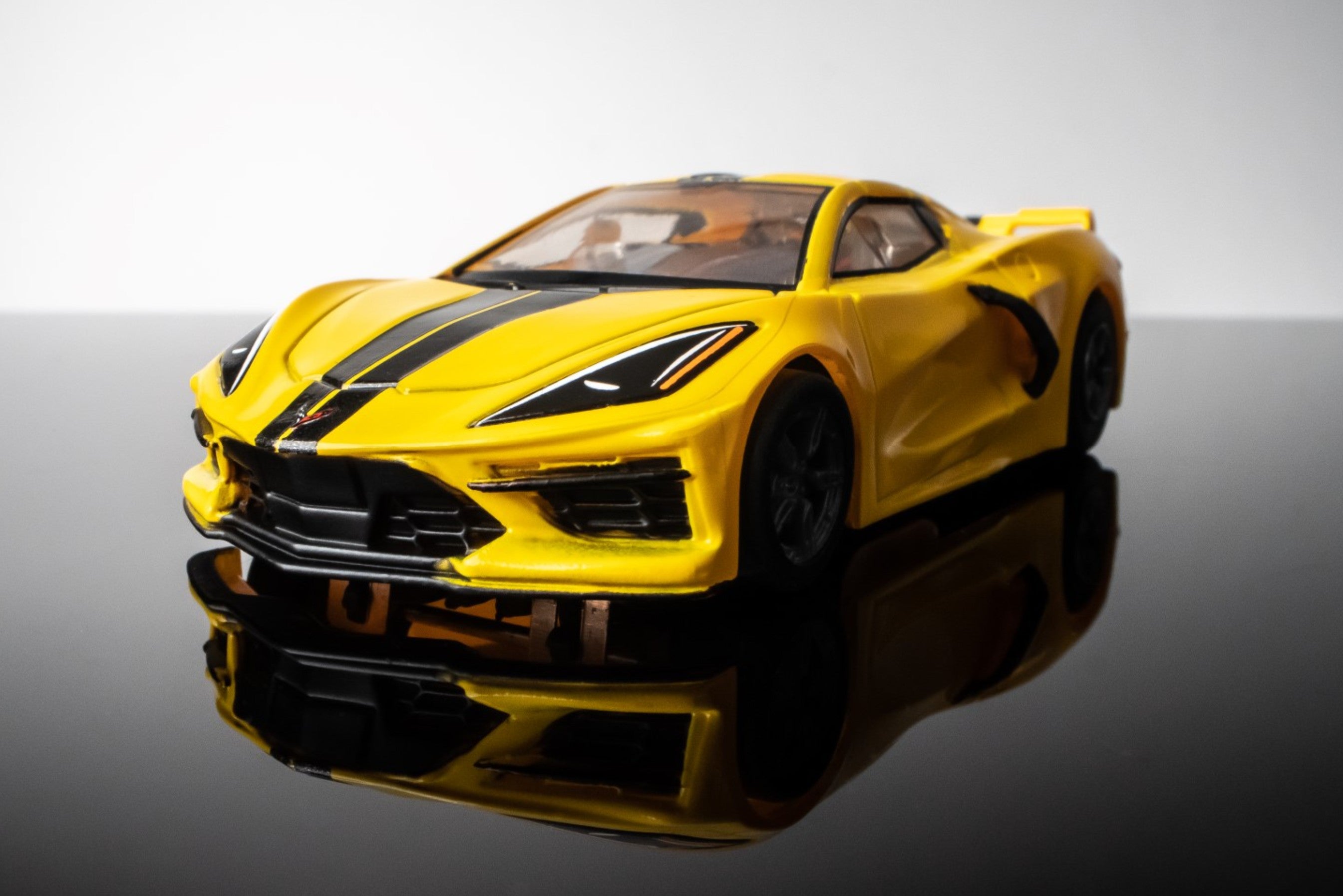 Left Front view of AFX Corvette C8 slot car in Accelerate Yellow 