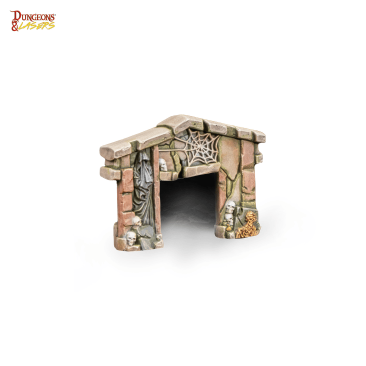 Isolated close-up view of the painted desecrated crypt entrance terrain piece featuring cracked brown bricks cobwebs and skeletal remains