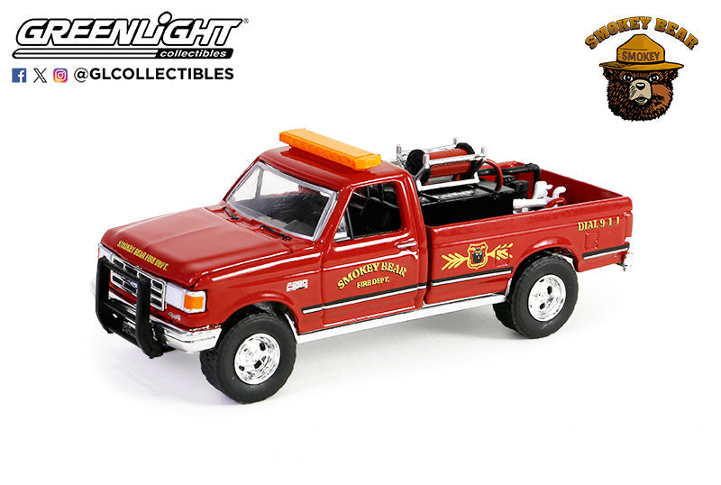 Side profile of 1990 Ford F-250 Smokey Bear truck with hose and tank