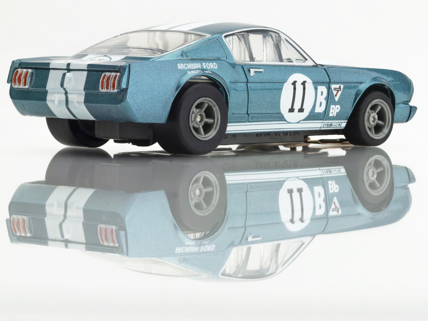 AFX Racing 1965 Shelby Mustang GT350R 1:64 scale slot car in Donohue blue with white stripes right rear view