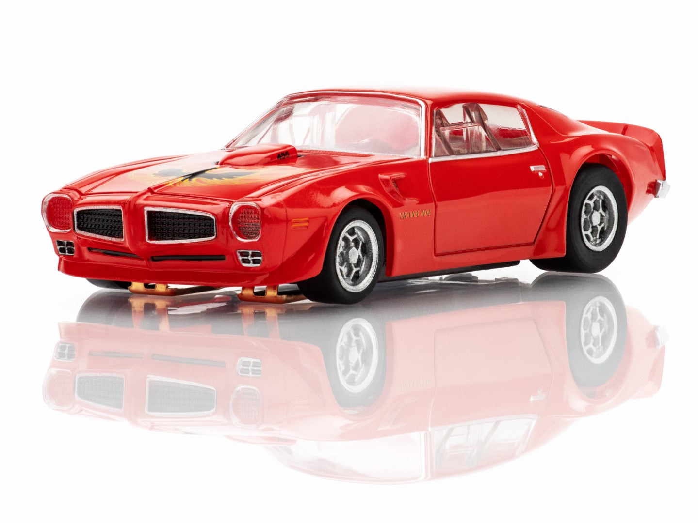 Left Front profile view of the red AFX 1973 Firebird Trans Am slot car highlighting the Honeycomb wheels and wide body.