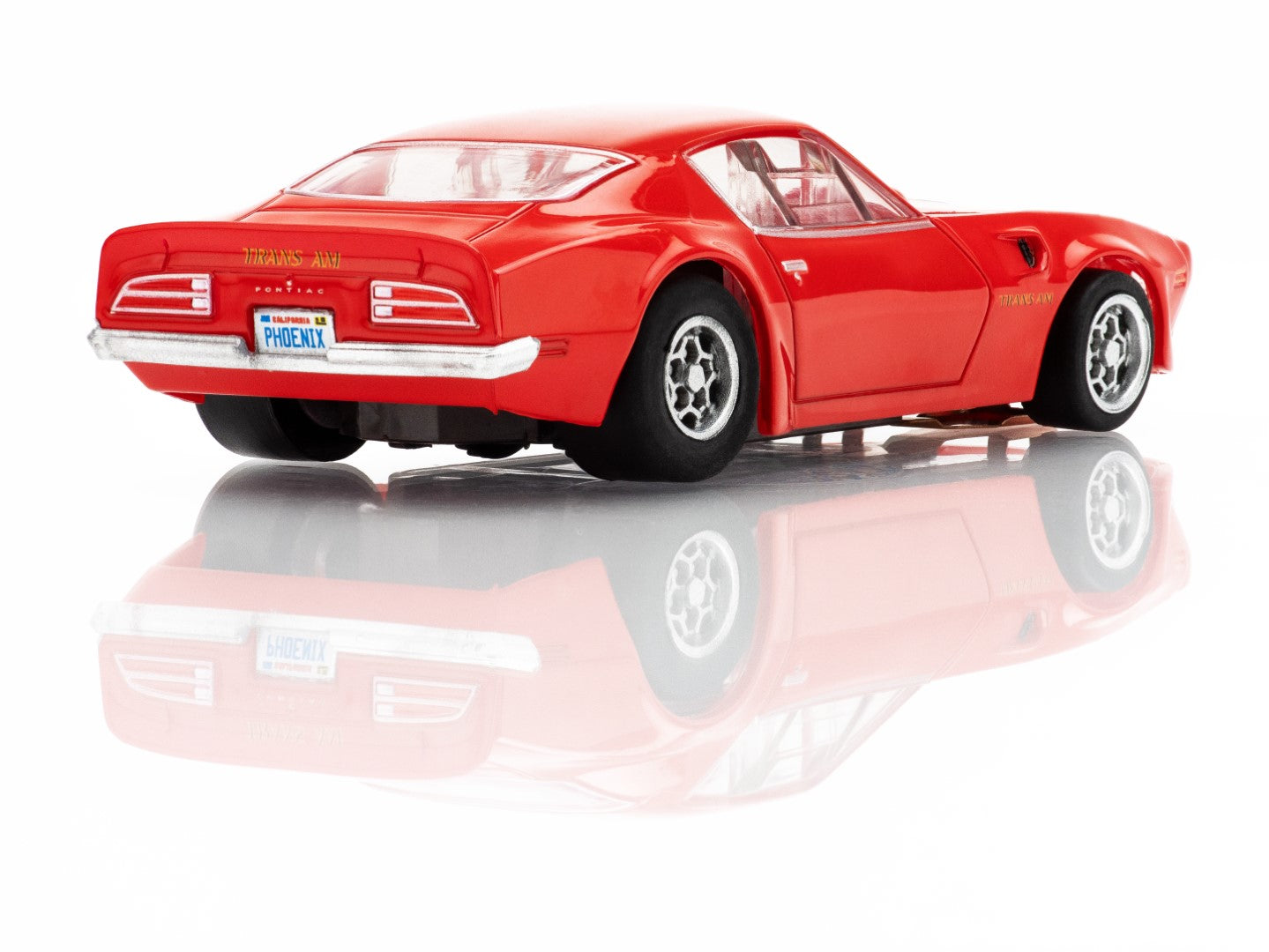 Right Rear profile view of the red AFX 1973 Firebird Trans Am slot car highlighting the Honeycomb wheels and wide body.