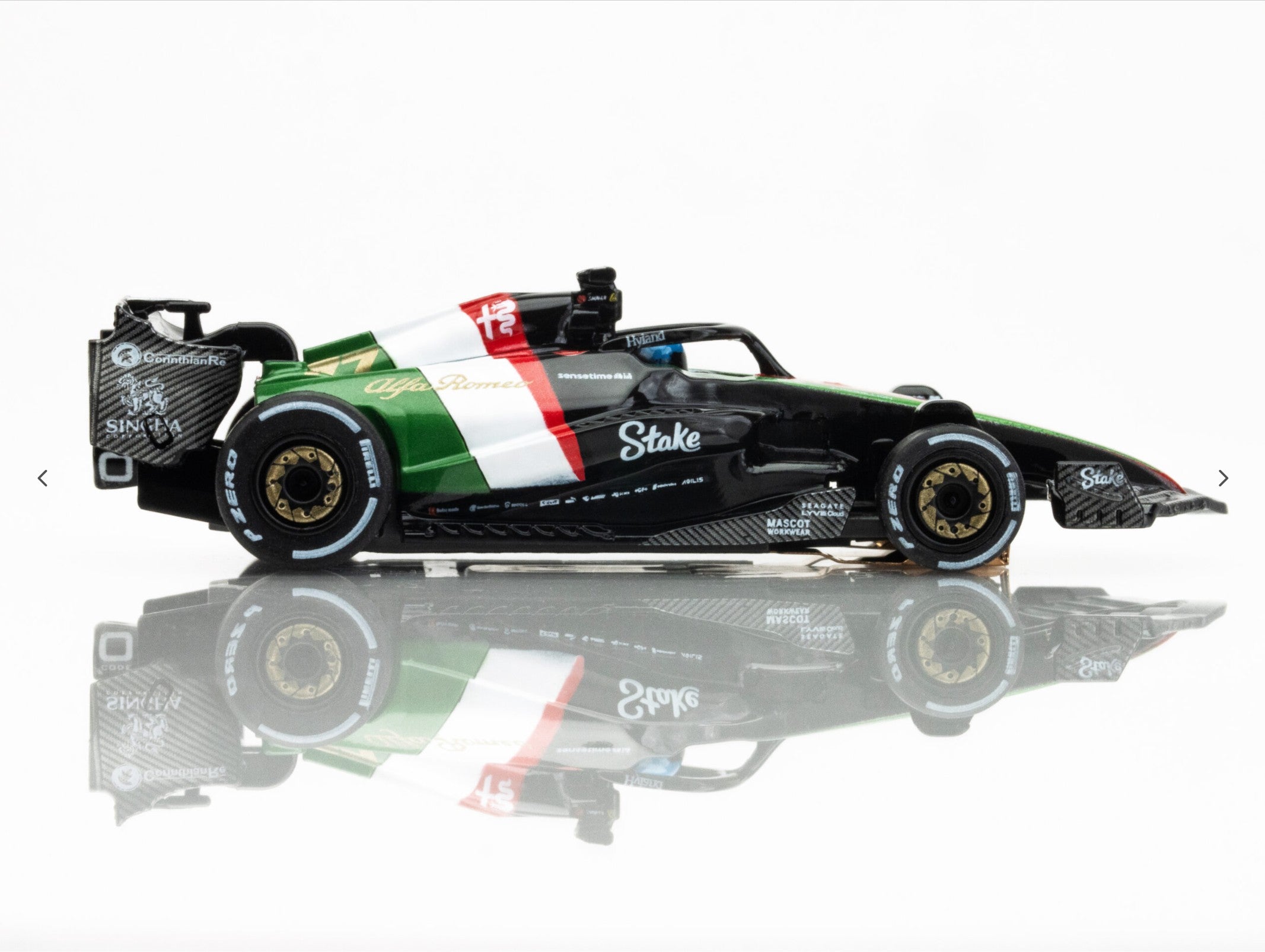 Right side view of AFX 2023 Alfa Romeo F1 Monza car showing gold wheels and aero detailing.