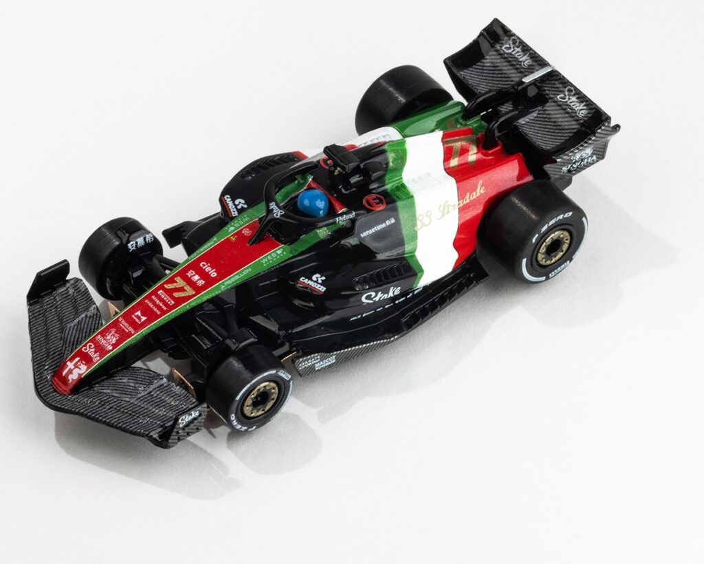 Top-down view of the 2023 Alfa Romeo F1 Monza slot car featuring red, white, and green Italian livery.