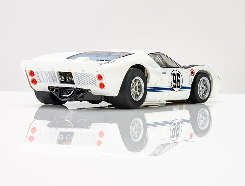 Rear angle view of AFX Ford GT40 MKII highlighting exhaust pipes, red taillights, and mesh grille. 