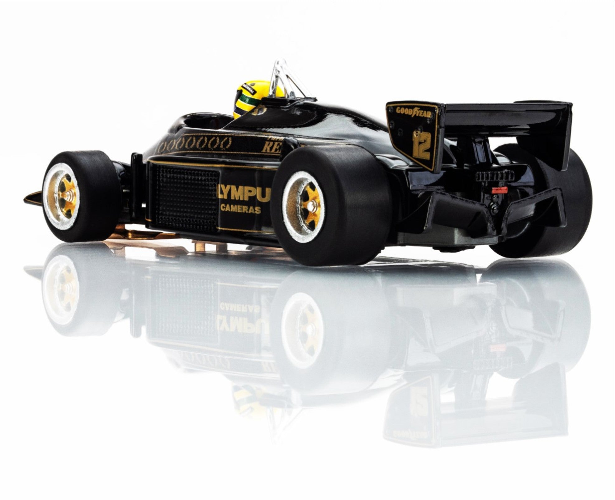 Rear-left angle view of the AFX Lotus 97T black and gold F1 car highlighting the Mega G+ long wheelbase chassis.