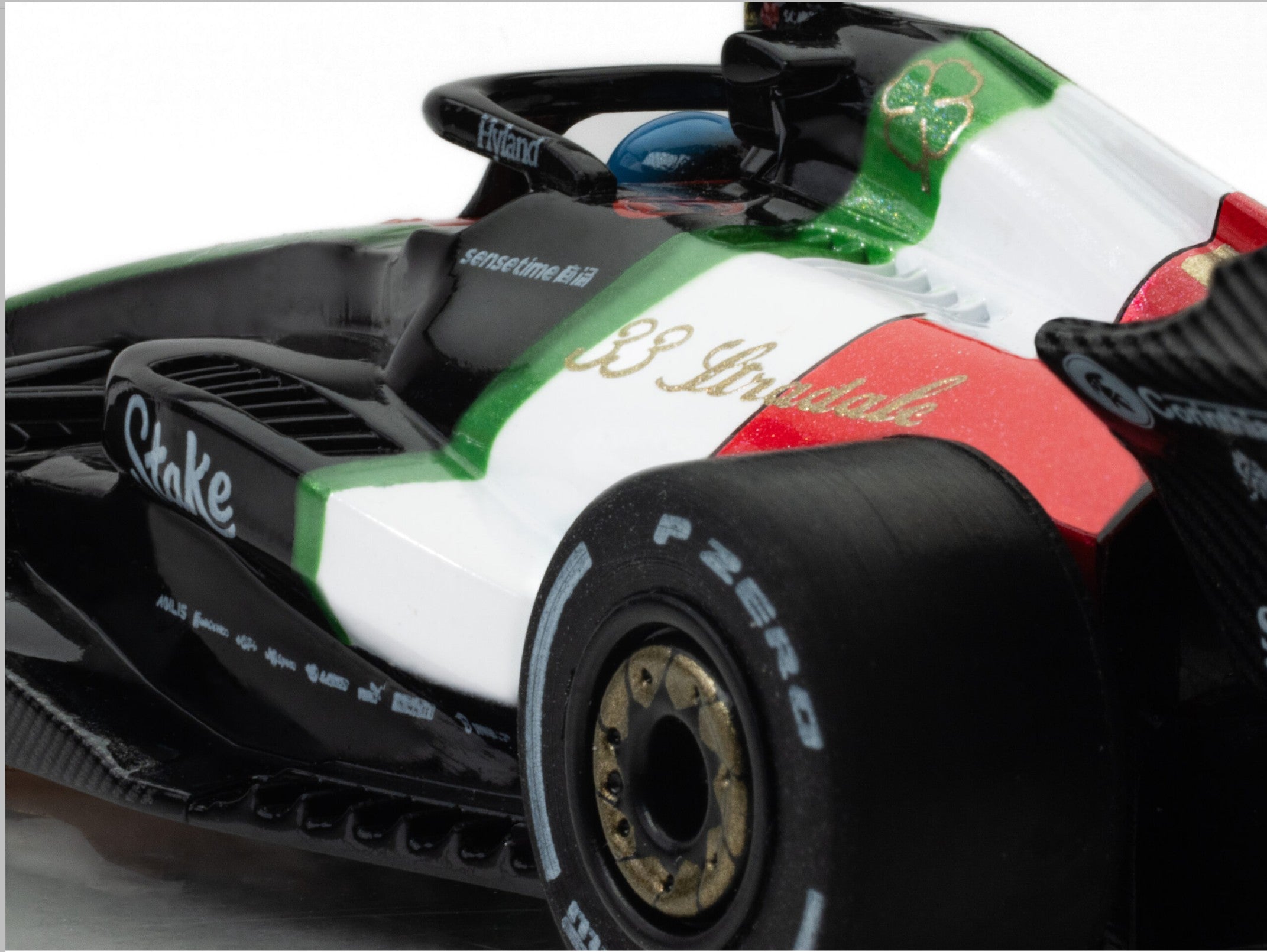 Macro closeup of the left rear angle AFX 2023 Alfa Romeo F1 slot car.