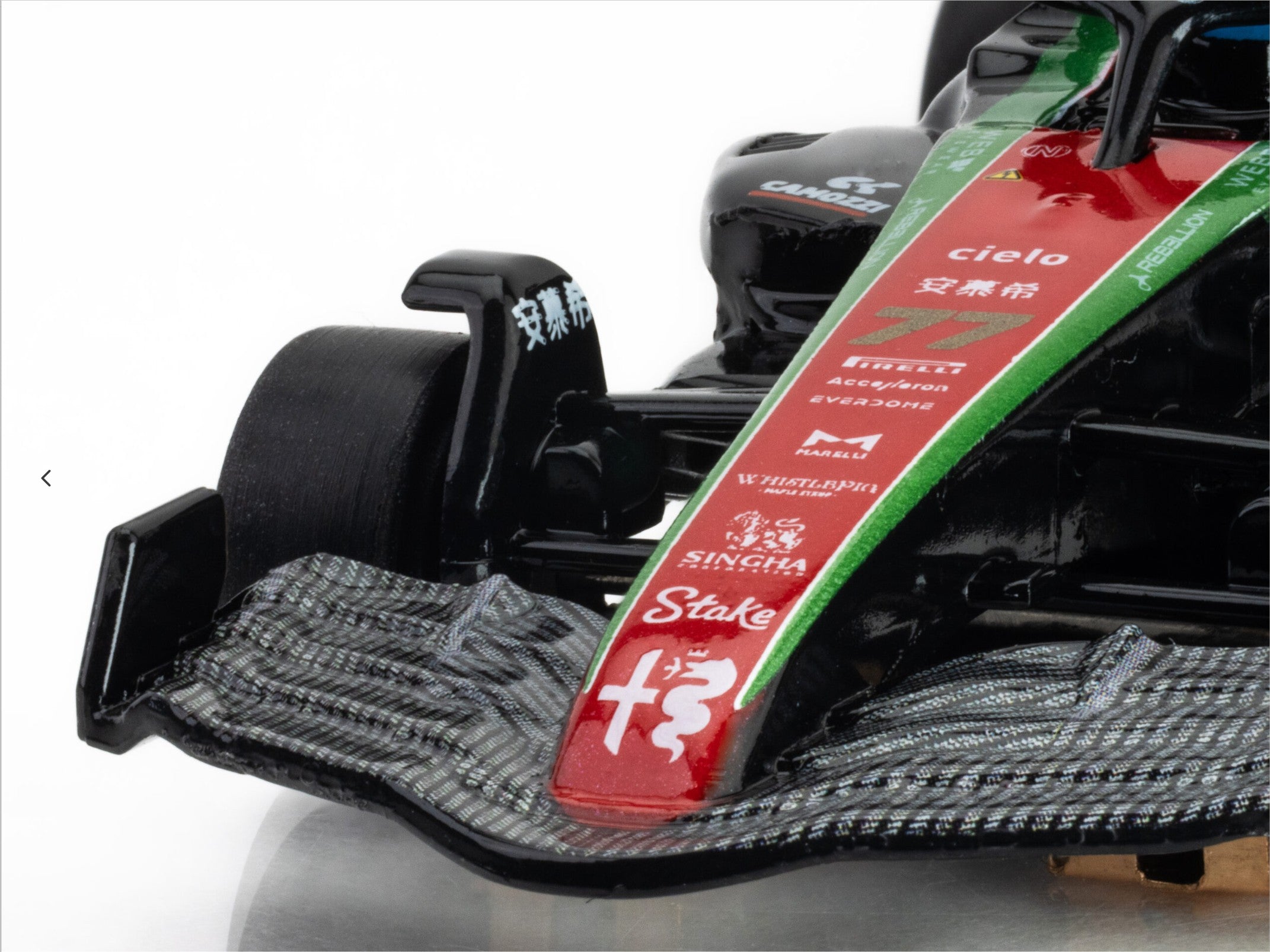 Macro closeup of the nose logos and front wing on the AFX 2023 Alfa Romeo F1 slot car.