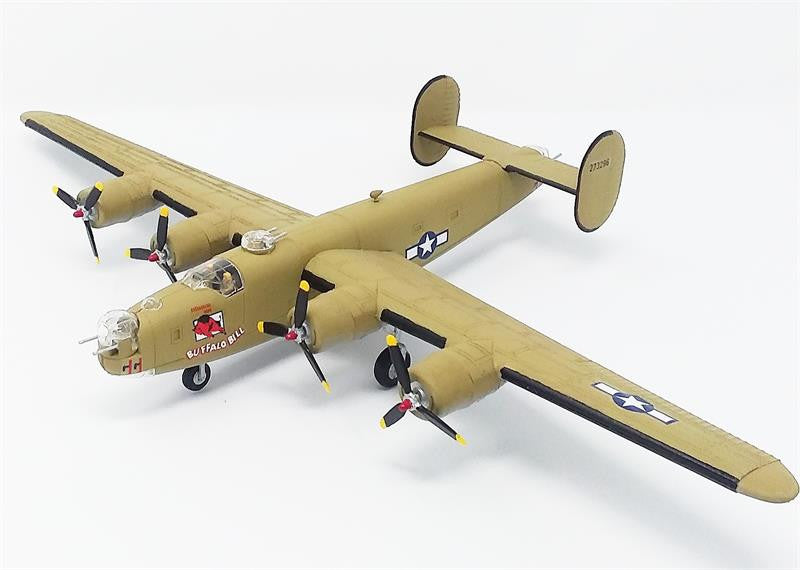 Overhead view of the assembled and painted khaki tan Atlantis B-24J Liberator model airplane on a clean white background