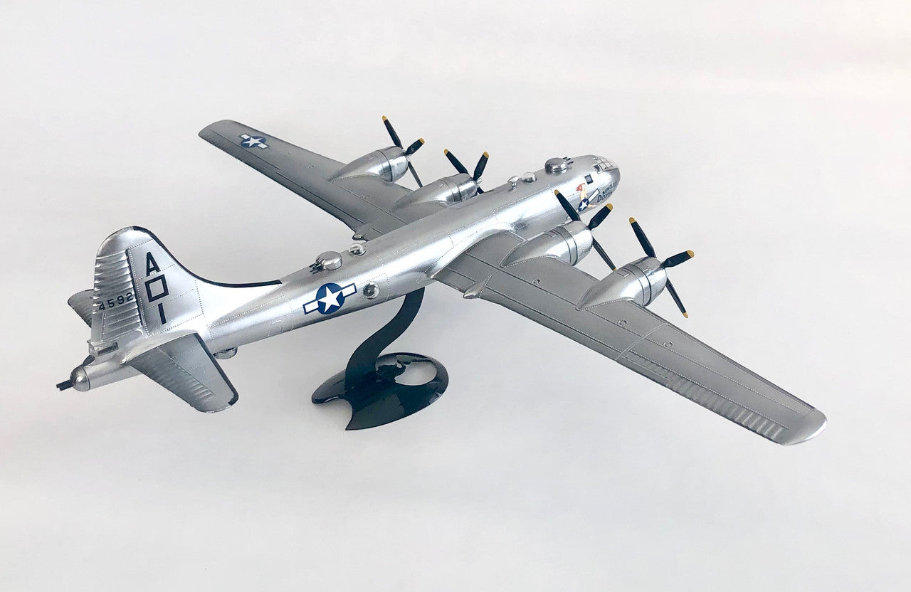 Rear quarter perspective view of the completed silver Atlantis B-29 model plane on its black swivel display base