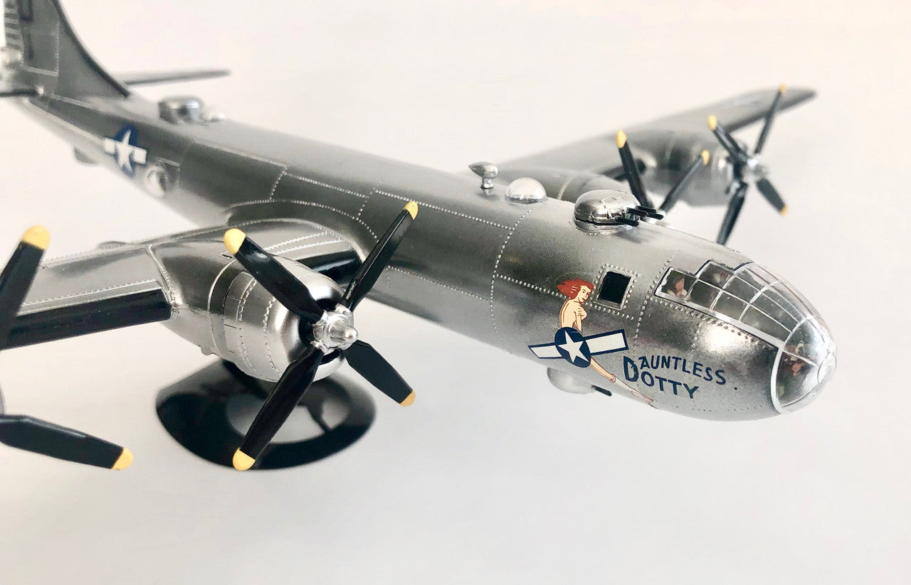 Macro detail shot of the applied Dauntless Dotty vintage nose art decal on the finished scale bomber cockpit