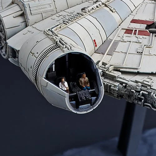 Close-up of Bandai Millennium Falcon cockpit with seated Lando and Poe pilot figures.