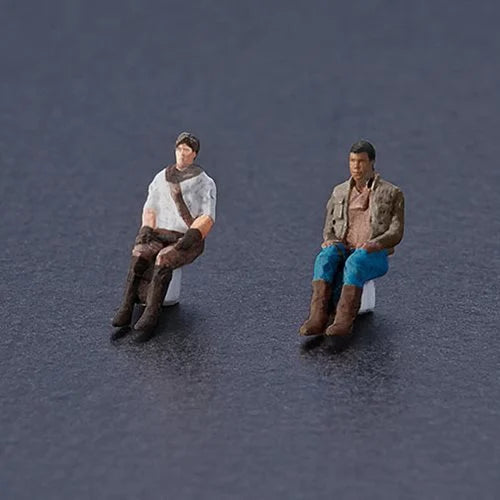 Close-up of Bandai Millennium Falcon  Seated Lando and Poe pilot figures.