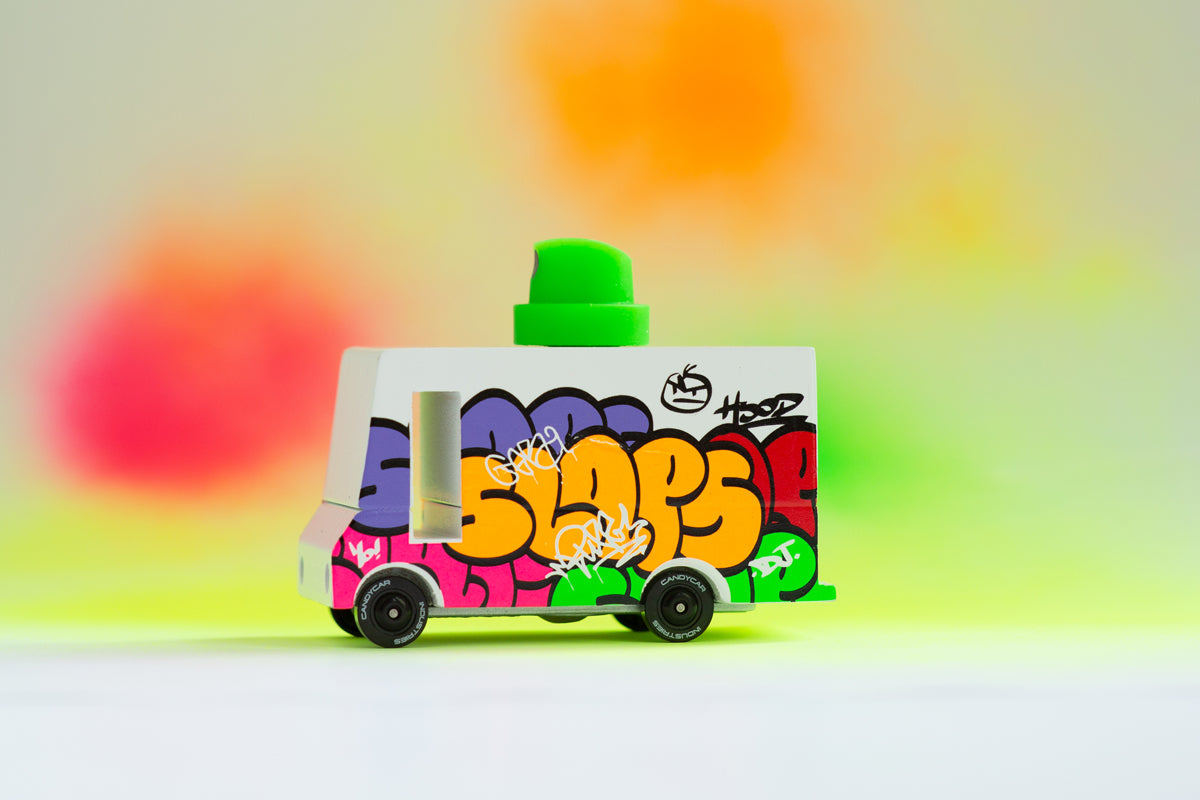 Candylab Toys Graffiti Green Wooden Vehicle – Lifestyle Scene with Urban Background