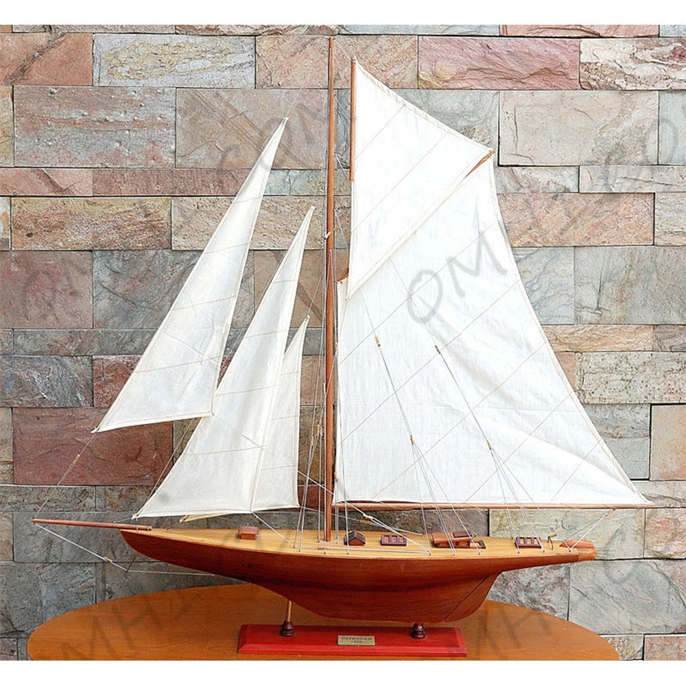 Captain Heritage Defender Sailboat Schooner Yacht, displaying the complete side view with natural wood grain finish and white sails.