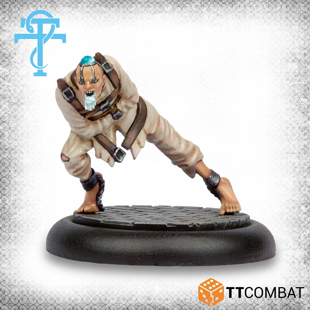 Painted model of a crouching Madman miniature in a straitjacket with a blue head fitting