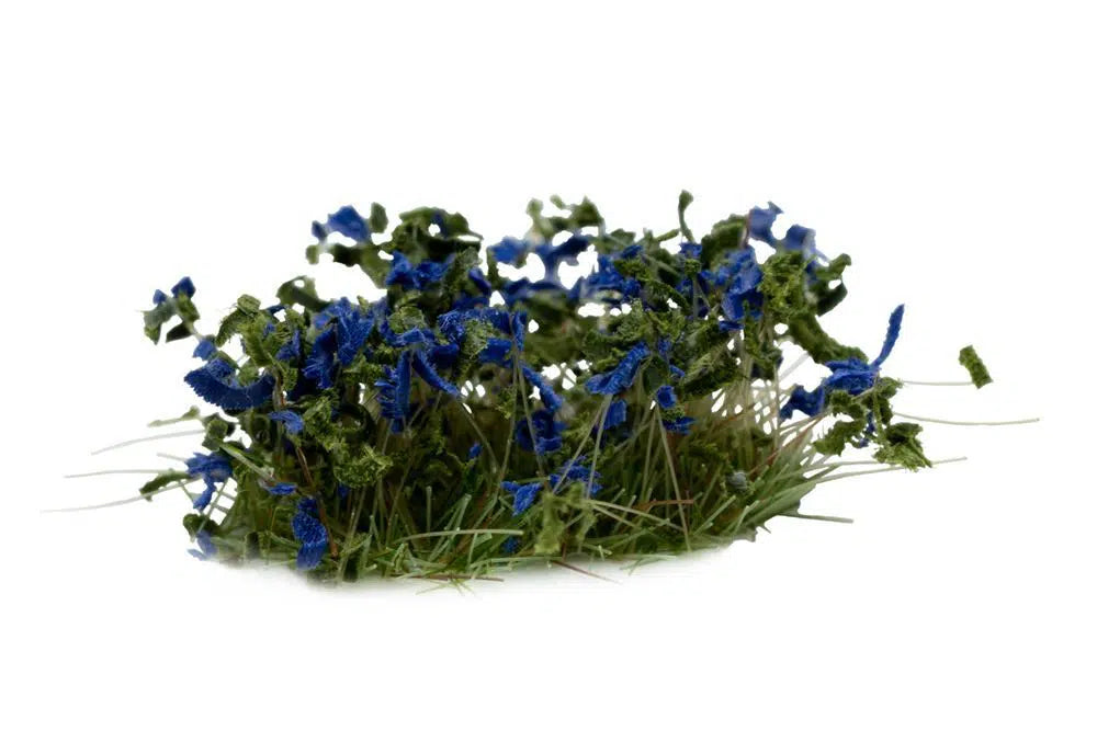 Close-up of GamersGrass Blue Flowers 6 mm tufts on a 28 mm base
