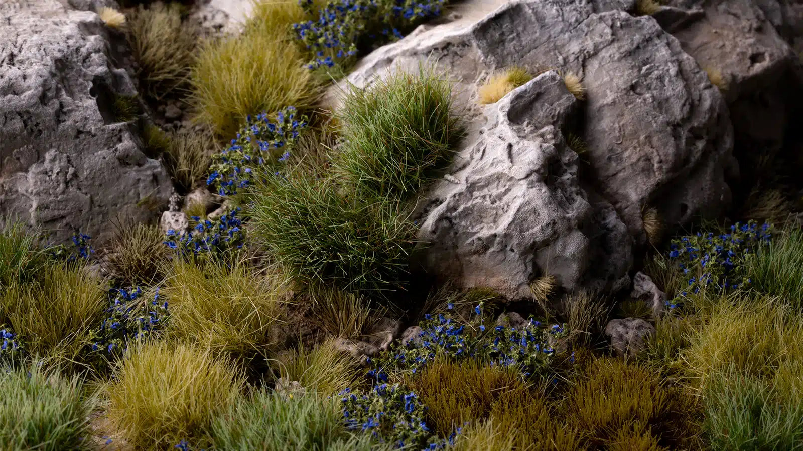 28 mm miniature base finished with GamersGrass Blue Flowers 6 mm tufts