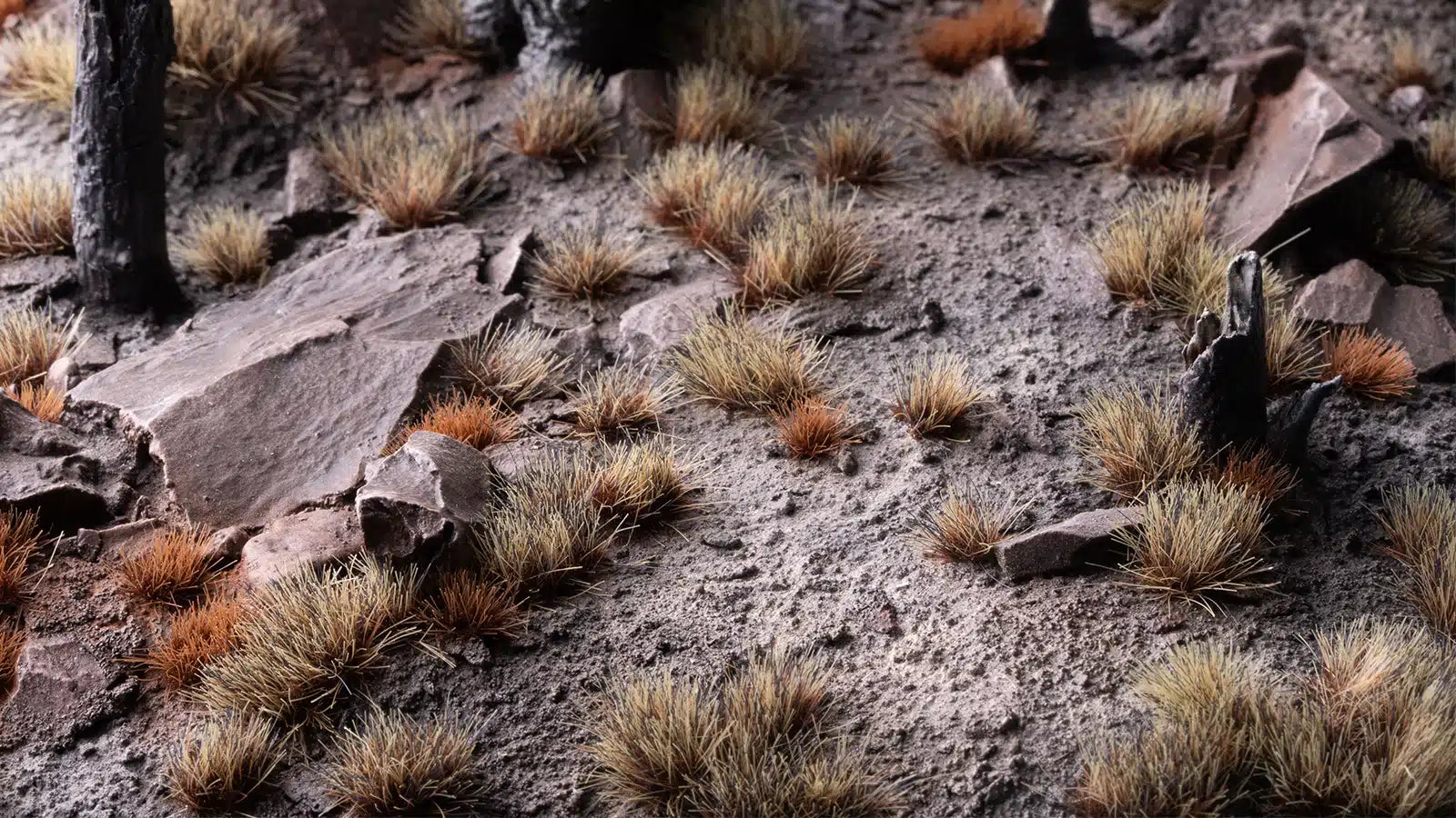 Professional diorama showing 6mm Burned Tufts used to simulate scorched ground and dark marsh vegetation.