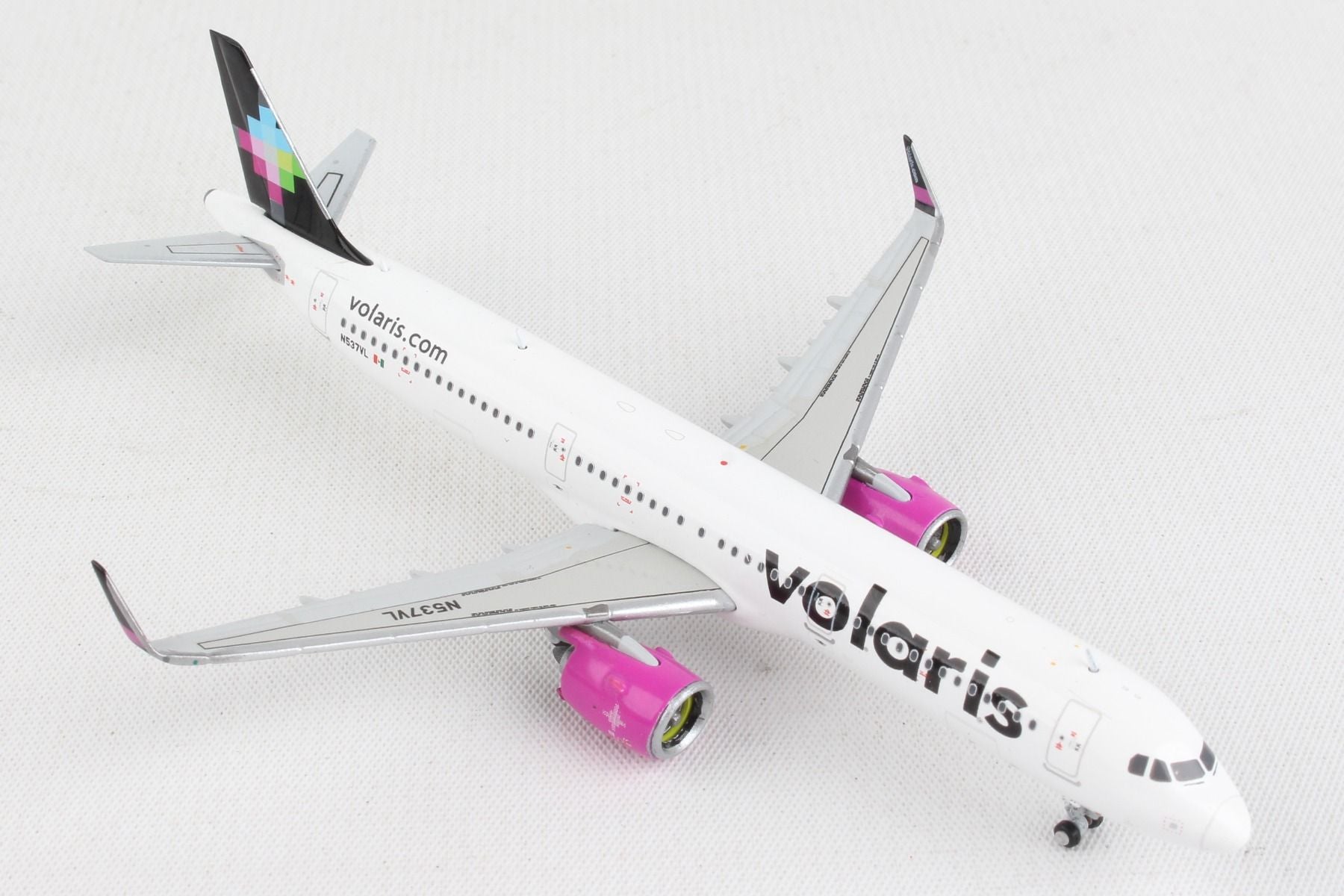 Elevated right front view of GeminiJets 1 by 400 scale Volaris Airbus A321neo diecast model showing tail design 