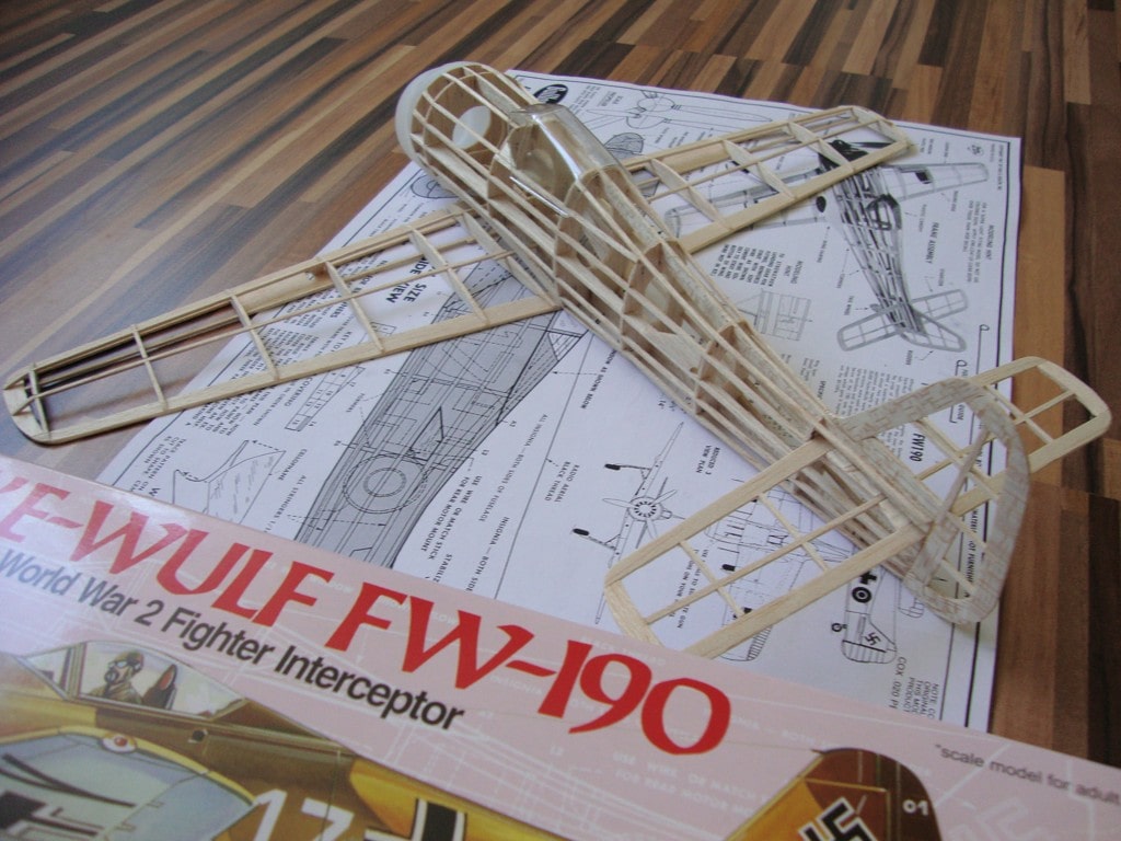 Assembled balsa wood airframe skeleton of the Guillow's Focke-Wulf Fw-190 model airplane on plans.