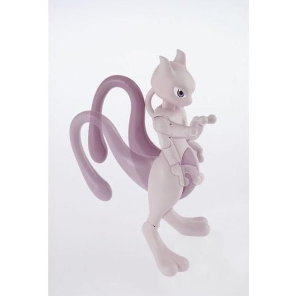 Detail showing Mewtwo model kit's tail raising to lift the right hand in a psychic pose