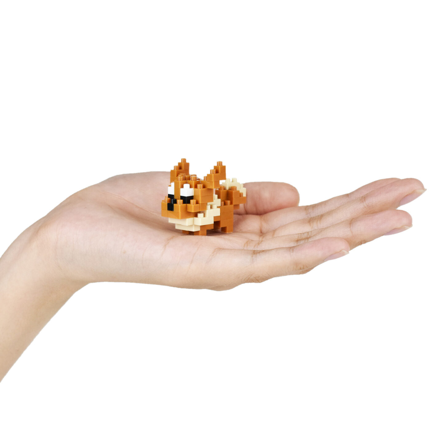 Macro shot of finished Eevee Nanoblock in palm of hand showing 1.38 inch micro-scale
