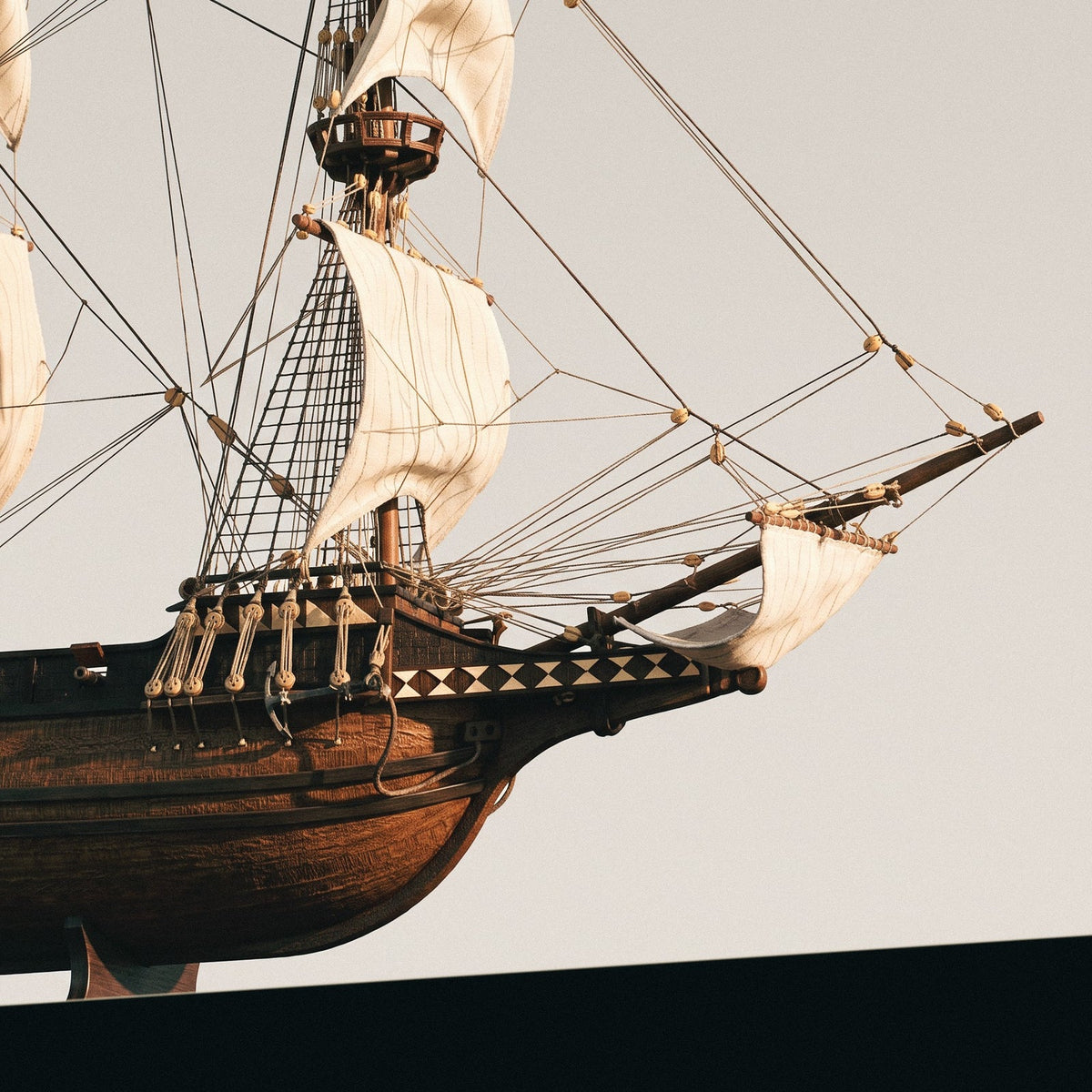 Detailed view of the bowsprit, running rigging, and wooden hull lines of the Occre 1/100 Buccaneer model