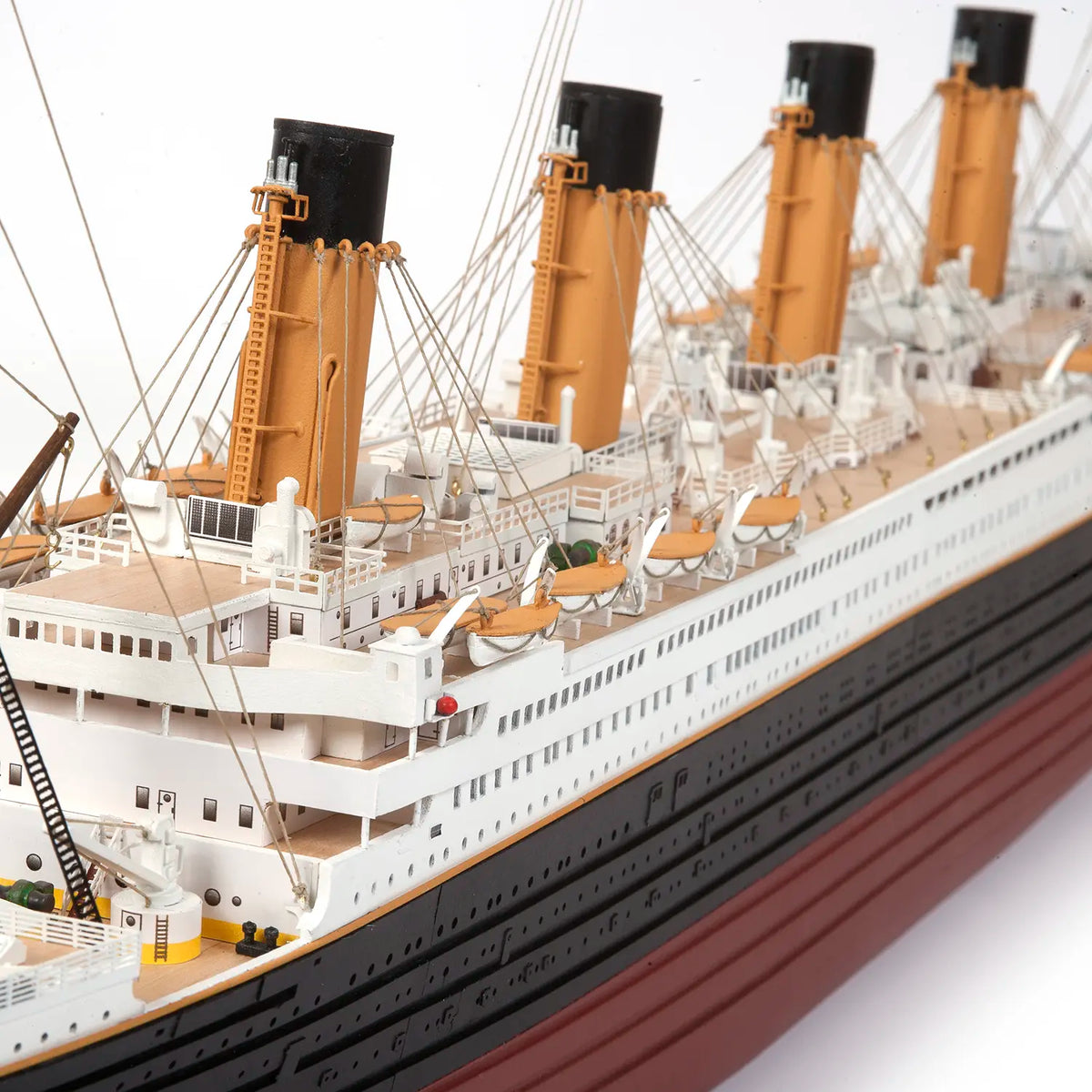 Elevated view of the boat deck showing yellow funnels and lifeboats on the Occre 1/300 Titanic 