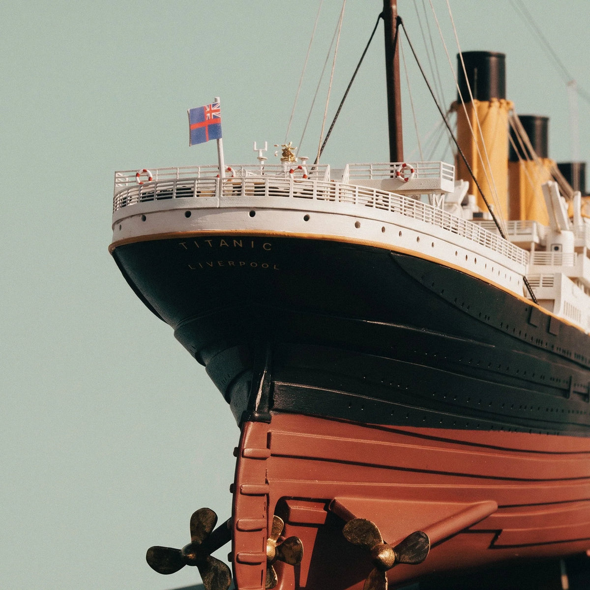 Close up view of the stern name lettering TITANIC LIVERPOOL and brass propellers on the Occre model 